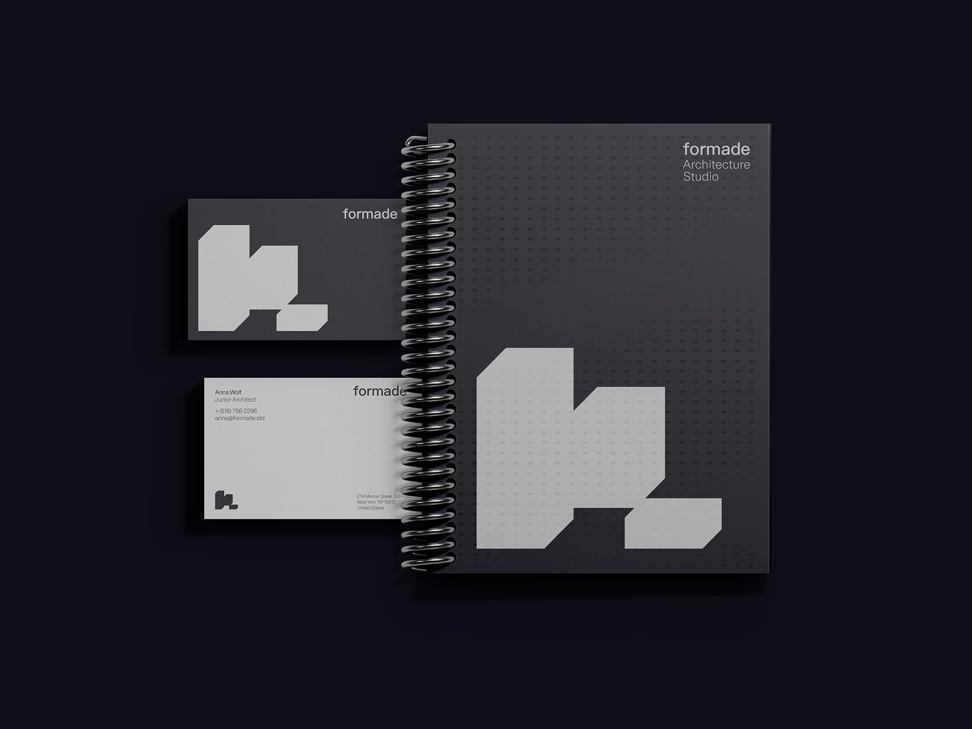 Presentación de papelería Formade con símbolo geométrico en tarjetas y cuaderno